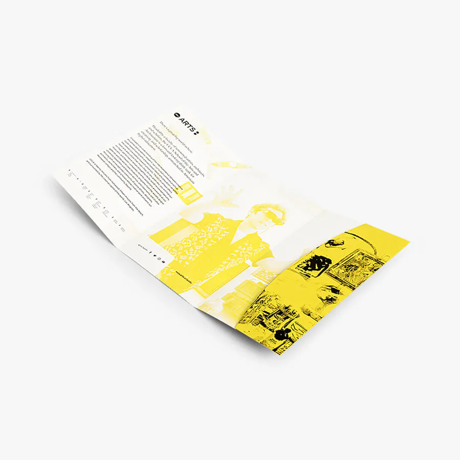 A tri-fold pocket mailer laying open and printed with a yellow and black design.