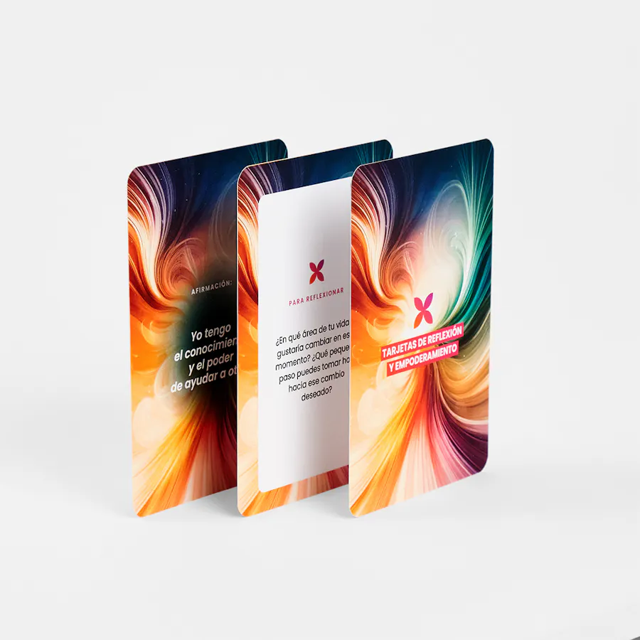 Three custom flashcards standing fanned out with Spanish text and swirling graphics in blue, red, orange and green.