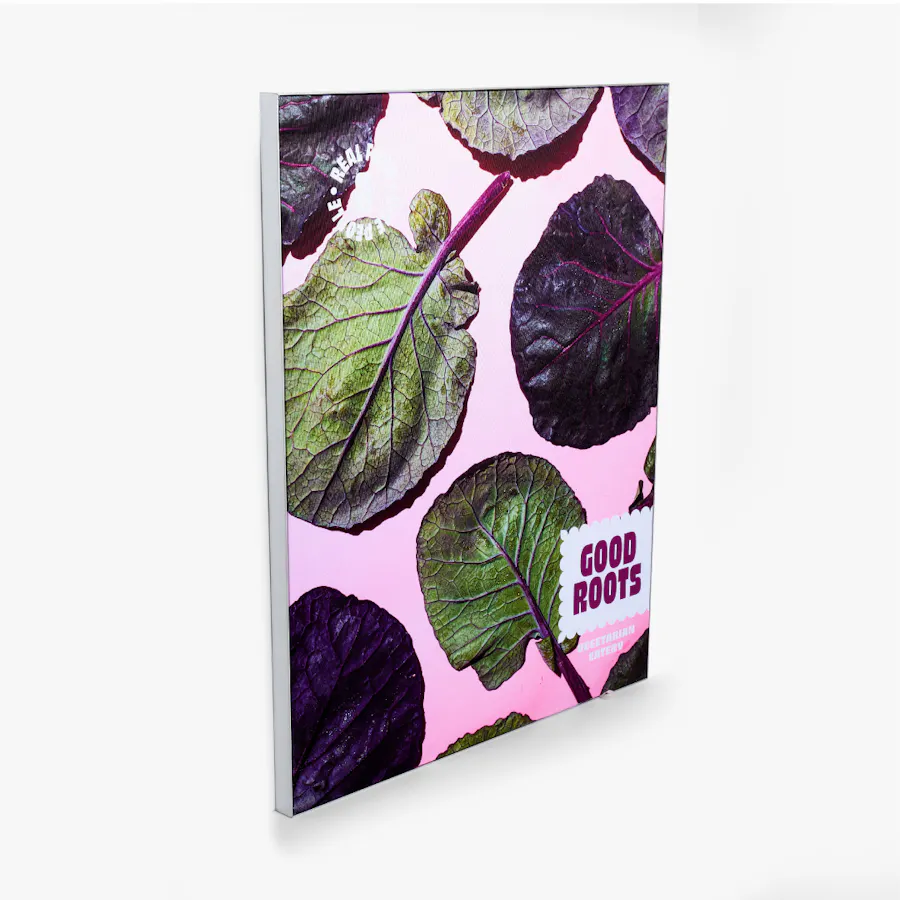 A custom sign printed with Good Roots in purple and large kale leaves.