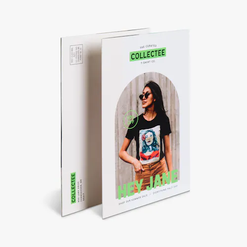Folded Self Mailer Two folded self-mailers overlapping each other and printed with a women wearing a graphic tee.