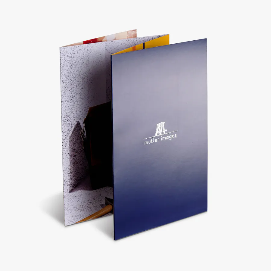 An accordion fold brochure standing and printed with a raised UV name and logo on the front.
