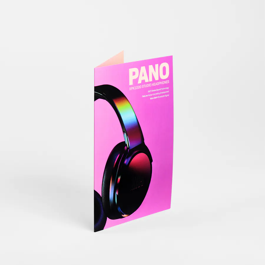 A pocket folder standing open with a bright pink cover and image of black headphones.