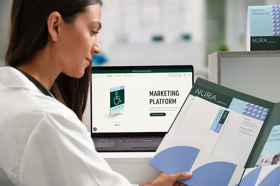 A female doctor holding a pocket folder with health care marketing materials in it.