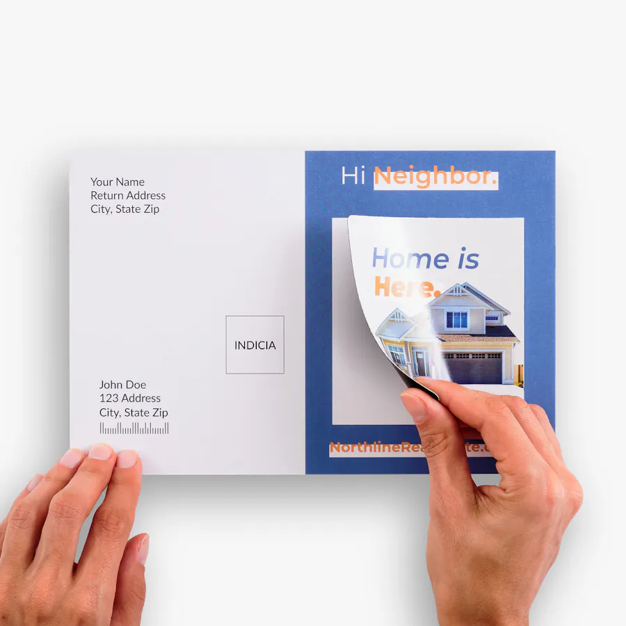 Two hands peeling a magnet off of a direct mail postcard with real estate branding.