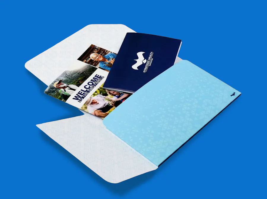 A custom welcome packet with booklets and brochures coming out of it.