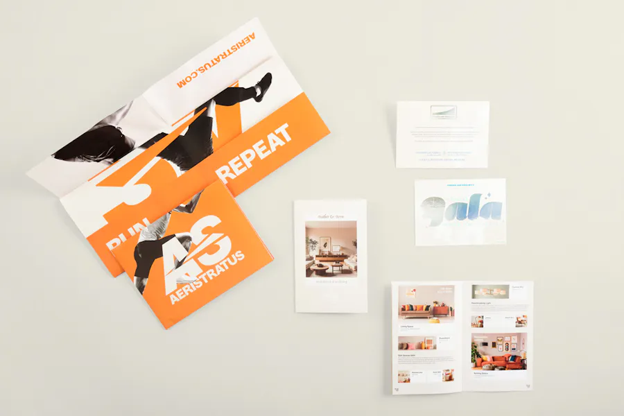 Posters, booklets and invites printed with various designs and Pantone Color of the Year 2026 Cloud Dancer.