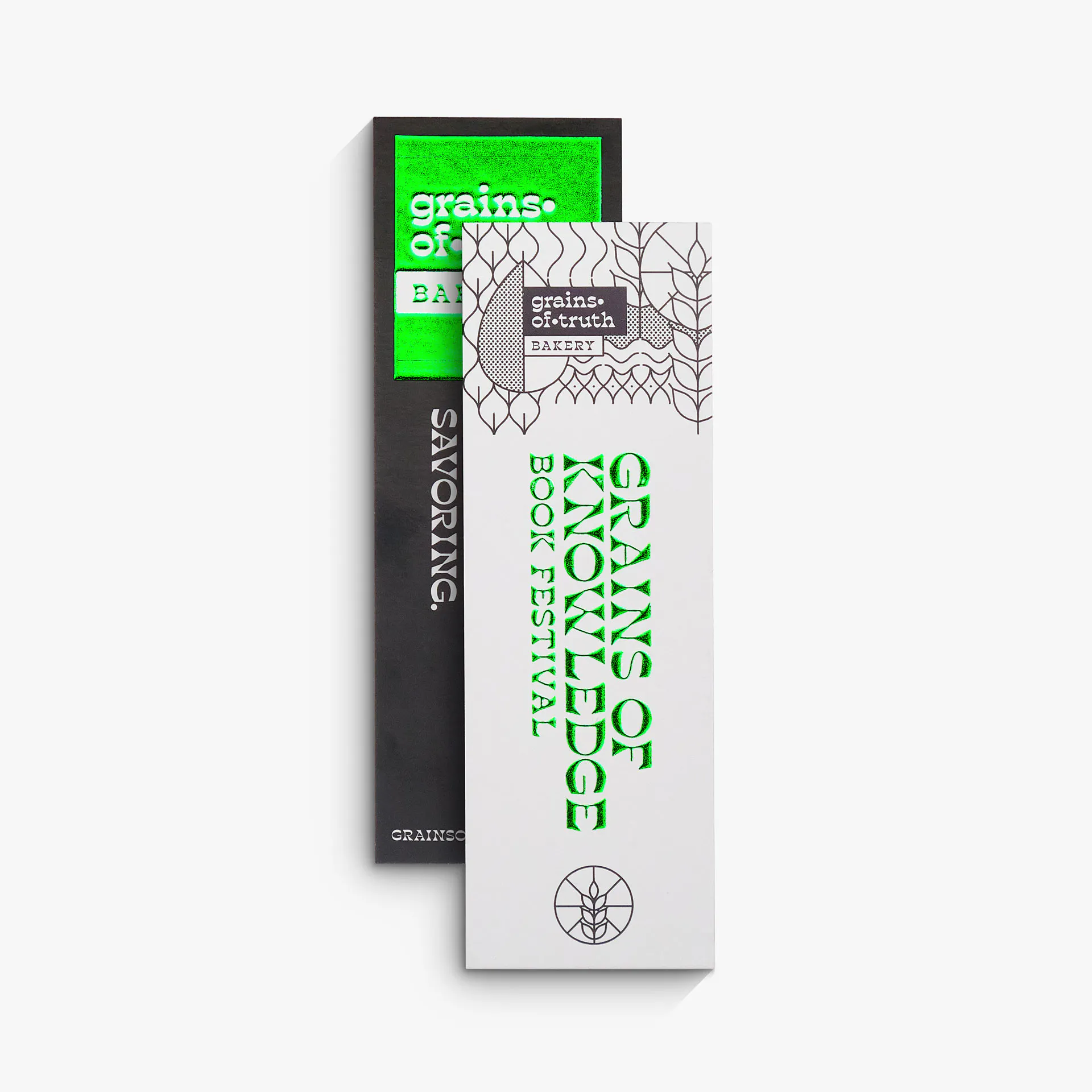 Two raised foil bookmarks overlapping each other and printed with green foil accents.