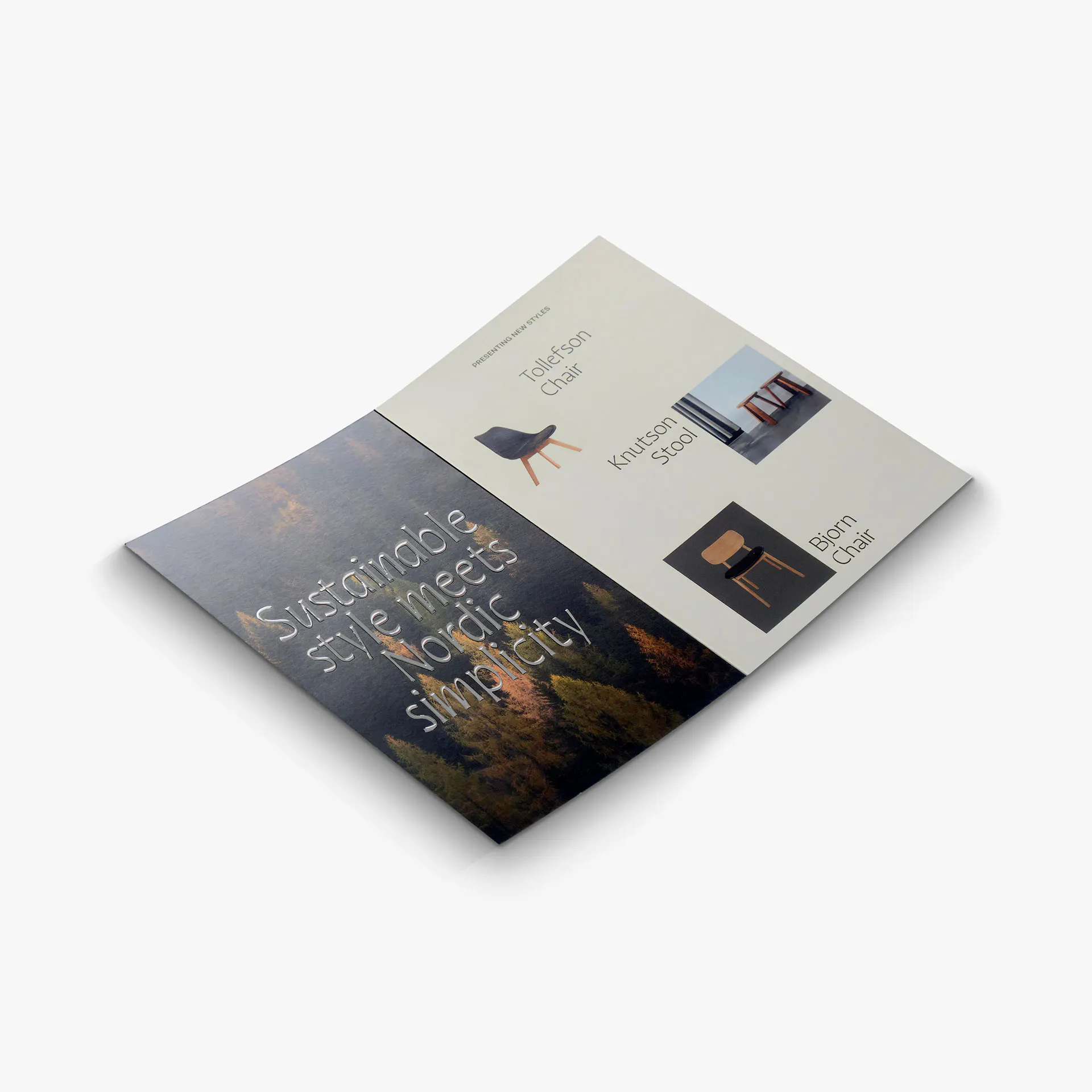 A raised foil brochure laying open with silver foil lettering and chair images.