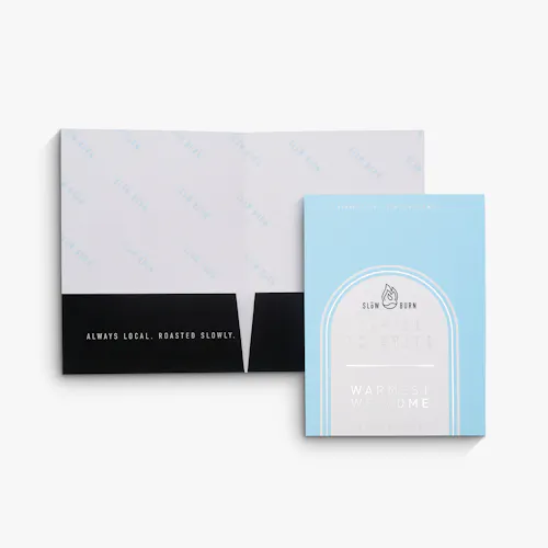Silver Matte Raised Foil Pocket Folder Two pocket folders printed with a light blue, black and silver raised foil design.